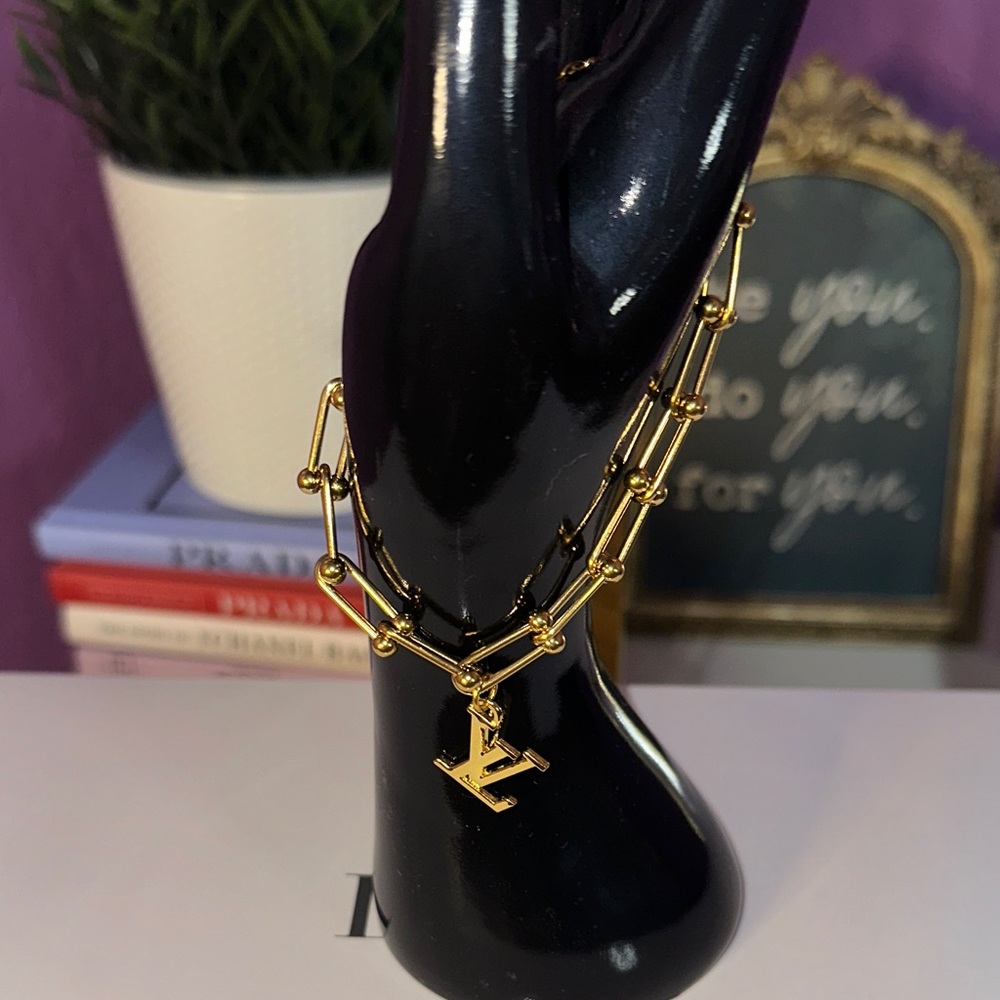 Authentic LV Charm on a Gold Plated Chain Bracelet